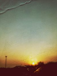 Close-up of water against sky during sunset