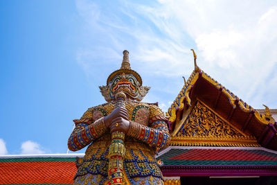 Low angle view of statue against building