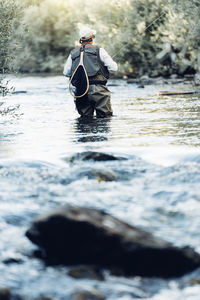 Man sitting in river