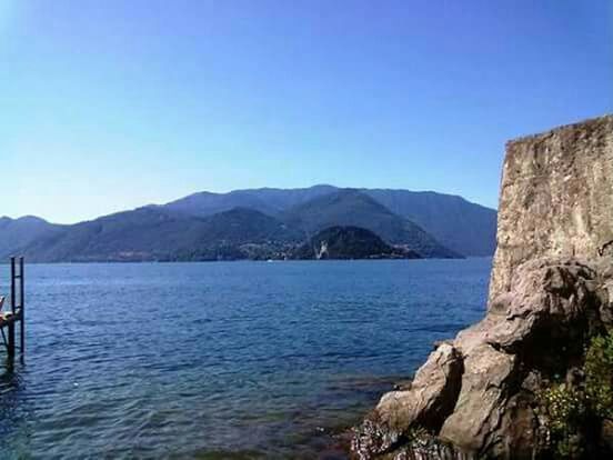 mountain, clear sky, water, mountain range, blue, tranquil scene, copy space, scenics, tranquility, beauty in nature, nature, lake, sea, idyllic, day, outdoors, waterfront, no people, river, landscape