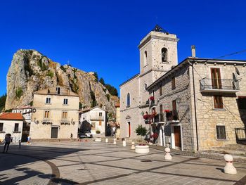 Panoramic view of historic building against clear blue sky