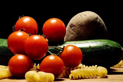 Close-up of tomatoes against black background