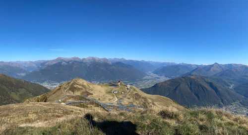 Scenic view of mountains against clear blue sky