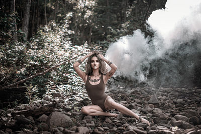 Portrait of young woman in forest