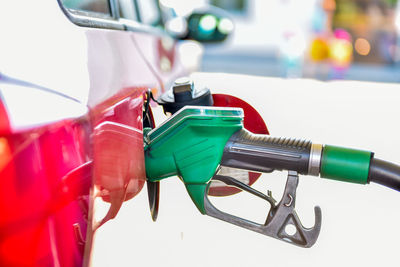 Close-up of fuel pump refueling car