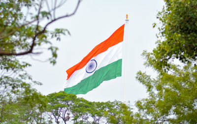 Low angle view of flag against sky