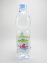 Close-up of empty glass bottle against white background