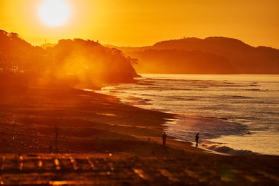 Scenic view of sea against sky during sunrise