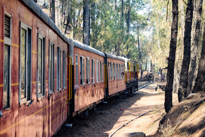 Kalka shimla toy train moving on mountain slopes, beautiful view, one side mountain, one side valley