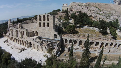 Abandoned amphitheater against blue sky