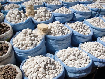 High angle view of dried potatoes for sale at market stall during sunny day