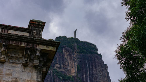 Low angle view of historical building against cloudy sky