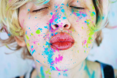 Close-up of woman with powder paint on her face