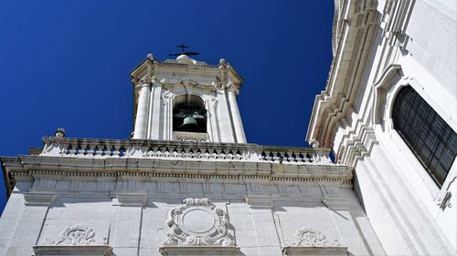 Low angle view of building against blue sky