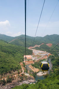 High angle view of overhead cable car against sky