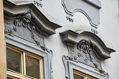 Low angle view of statue against historic building