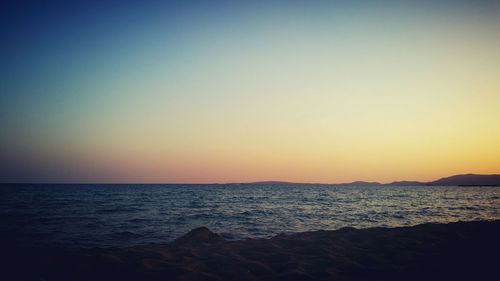Scenic view of sea at sunset