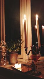 Close-up of candles on table at home