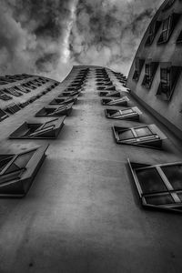 Low angle view of building against cloudy sky