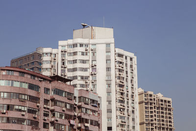 Low angle view of buildings against clear sky