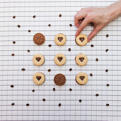 High angle view of hand holding cookies