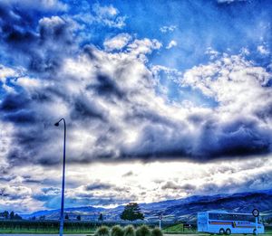 Scenic view of landscape against cloudy sky