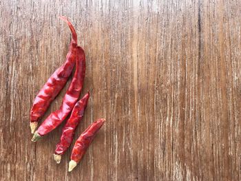 Close-up of red chili peppers on table