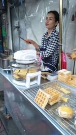 Young man preparing food in kitchen