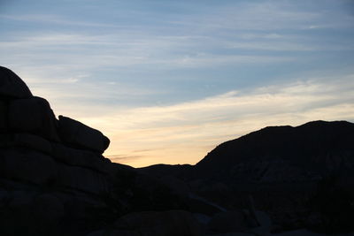 Scenic view of mountains at sunset