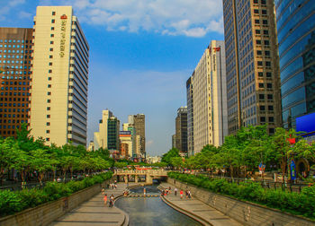 Street amidst buildings against sky