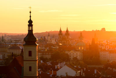 Cityscape against sky during sunset