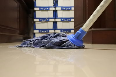 Close-up of blue umbrella on floor at home