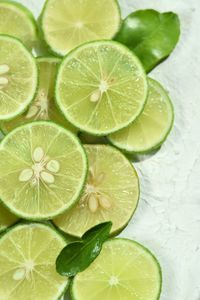 High angle of lime in slice for wallpaper