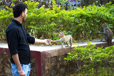 Full length of man with dog