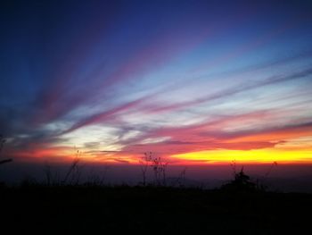 Silhouette landscape against sky during sunset