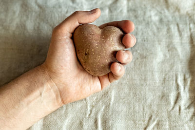 High angle view of man holding bread