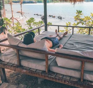 Man lying on back and admiring the sea