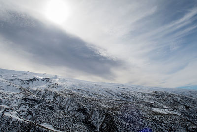 Scenic view of mountains against sky during winter