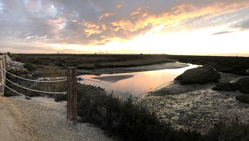 Panoramic view of beach against sky during sunset