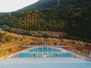 Built structure by mountain during autumn