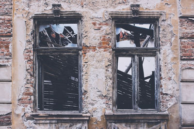 Damaged window of old building