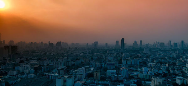 High angle view of buildings against sky during sunset