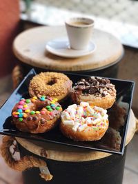 Close-up of donuts in plate on table