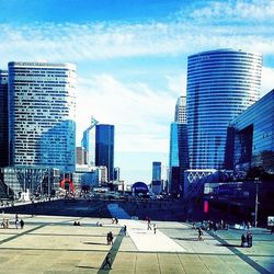 Buildings in city against sky