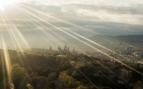 High angle view of town against cloudy sky