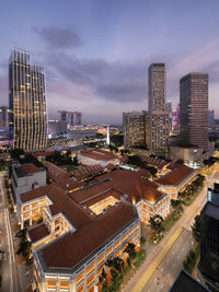 High angle view of illuminated buildings in city against sky