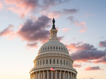 Low angle view of building against sky during sunset