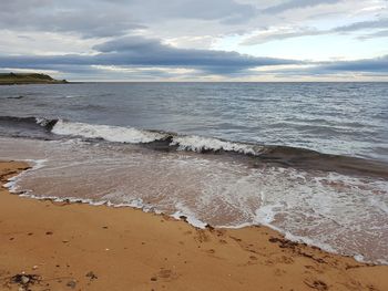 Scenic view of beach against sky