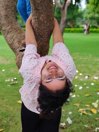 Low angle view of girl on field