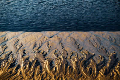 High angle view of sand on beach